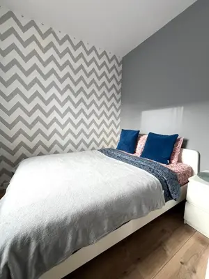 Łóżko lub łóżka w pokoju w obiekcie Close to Chopin airport, Moduo Cybernetyki, free parking by Cosmo Spirit