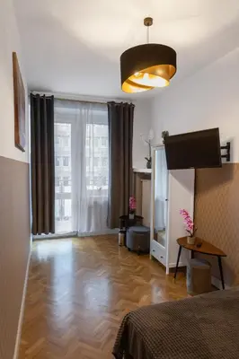 Łóżko lub łóżka w pokoju w obiekcie ClickTheFlat Krucza City Center Apart Rooms