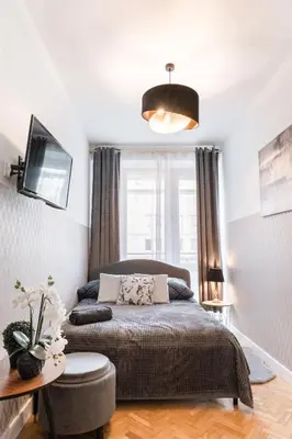 Łóżko lub łóżka w pokoju w obiekcie ClickTheFlat Krucza City Center Apart Rooms