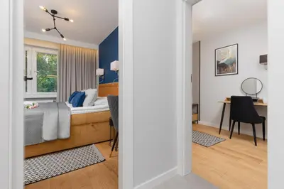 Łóżko lub łóżka w pokoju w obiekcie Warneńska Apartment by Noclegi Renters