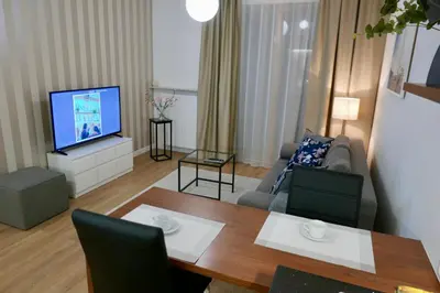 Telewizja i/lub zestaw kina domowego w obiekcie Zdrowa Apartment in Wilanów