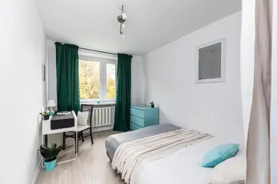 Łóżko lub łóżka w pokoju w obiekcie Deotymy 19 SuperApart - Blisko metra Księcia Janusza