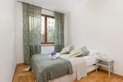 Łóżko lub łóżka w pokoju w obiekcie Warsaw Bobrowiecka Apartment by Noclegi Renters