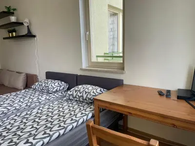 Łóżko lub łóżka w pokoju w obiekcie Pokoje Mokotów