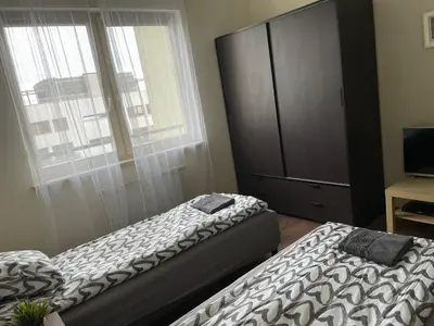 Łóżko lub łóżka w pokoju w obiekcie Pokoje Mokotów
