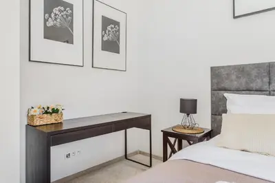 Łóżko lub łóżka w pokoju w obiekcie Slominskiego 7 P&O Apartments