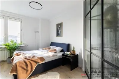 Łóżko lub łóżka w pokoju w obiekcie P&O Apartments Bitwy Warszawskiej - Ochota
