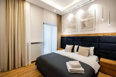Łóżko lub łóżka w pokoju w obiekcie Złota Sophisticated Apartment by BookingHost