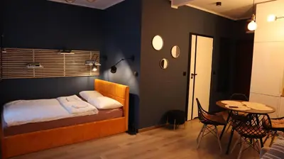 Łóżko lub łóżka w pokoju w obiekcie ZŁOTA KOBIETA