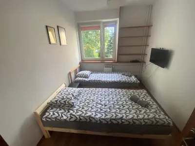 Łóżko lub łóżka w pokoju w obiekcie Pokoje Bora-Komorowskiego