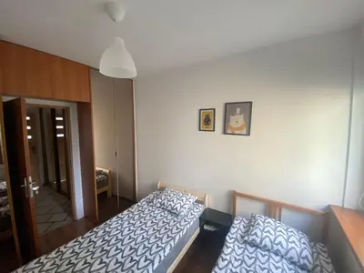 Łóżko lub łóżka w pokoju w obiekcie Pokoje Bora-Komorowskiego