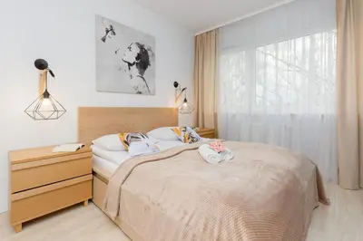 Łóżko lub łóżka w pokoju w obiekcie Warsaw Sokołowska One Bedroom Apartament by Noclegi Renters