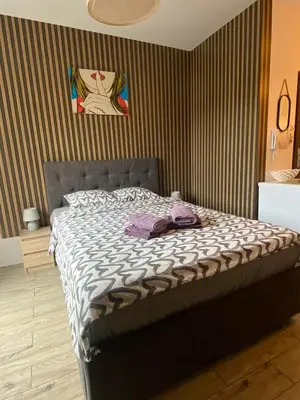 Łóżko lub łóżka w pokoju w obiekcie Wczasowa 3