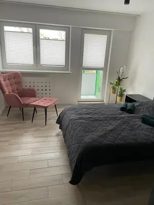 Łóżko lub łóżka w pokoju w obiekcie Brzostek Apartamenty
