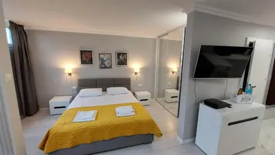 Łóżko lub łóżka w pokoju w obiekcie Elegancki apartament w sercu Warszawy