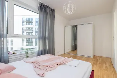 Łóżko lub łóżka w pokoju w obiekcie ShortStayPoland Sikorskiego (B103)