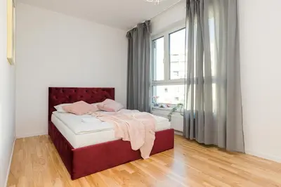 Łóżko lub łóżka w pokoju w obiekcie ShortStayPoland Sikorskiego (B103)