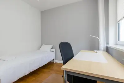 Łóżko lub łóżka w pokoju w obiekcie ShortStayPoland Bartycka (B105)