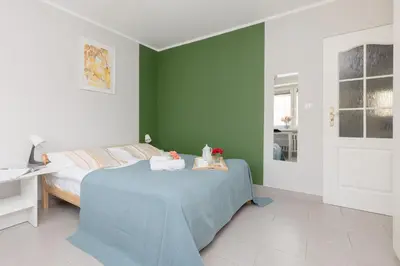 Łóżko lub łóżka w pokoju w obiekcie Warsaw Apartment Dolinka Batuty by Noclegi Renters