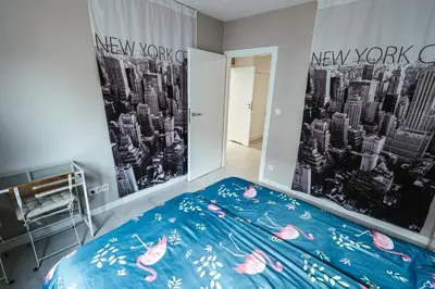 Łóżko lub łóżka w pokoju w obiekcie Apartamenty Bokserska
