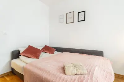 Łóżko lub łóżka w pokoju w obiekcie Modern 2 Bedroom Apartment with Parking Bemowo