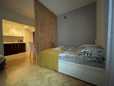 Łóżko lub łóżka w pokoju w obiekcie Bonifraterska 15 Studio - Old Town Apartment
