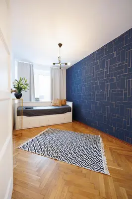 Łóżko lub łóżka w pokoju w obiekcie Maison Brühl - Apartamenty przy Ogrodzie Saskim