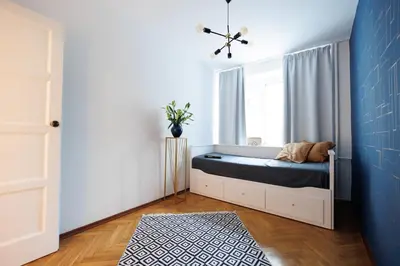 Łóżko lub łóżka w pokoju w obiekcie Maison Brühl - Apartamenty przy Ogrodzie Saskim