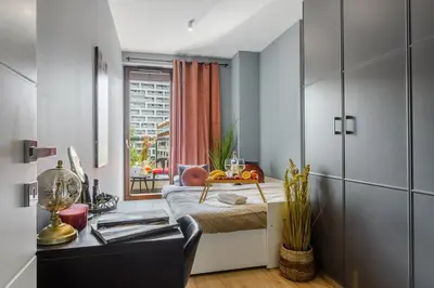 Łóżko lub łóżka w pokoju w obiekcie Lumina 3-room apart with parking, balcony