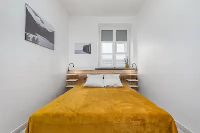 Łóżko lub łóżka w pokoju w obiekcie Krakowskie Przedmieście 69 by Homeprime