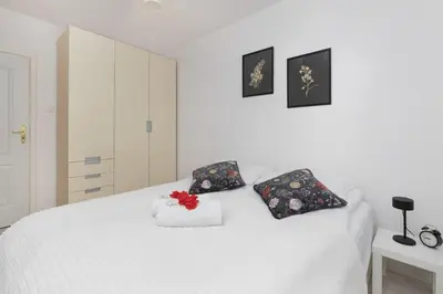 Łóżko lub łóżka w pokoju w obiekcie Warsaw Ursynów Modern Apartment by Noclegi Renters