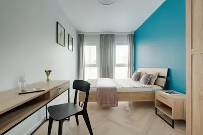 Łóżko lub łóżka w pokoju w obiekcie Apartamenty Stadion Narodowy