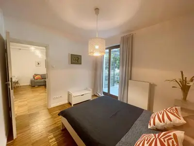 Łóżko lub łóżka w pokoju w obiekcie Apartment Powiśle with Garage