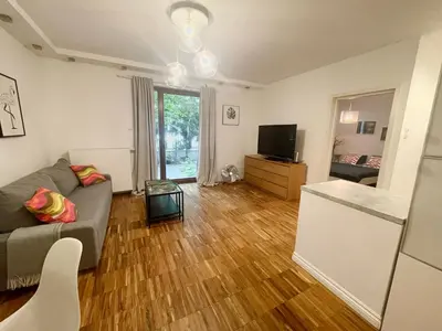 Telewizja i/lub zestaw kina domowego w obiekcie Apartment Powiśle with Garage