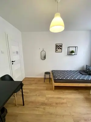 Łóżko lub łóżka w pokoju w obiekcie Warszawa Centrum Pokoje