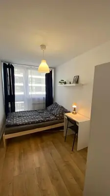 Łóżko lub łóżka w pokoju w obiekcie Warszawa Centrum Pokoje