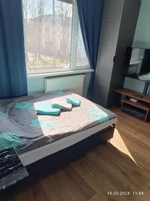 Łóżko lub łóżka w pokoju w obiekcie Apartament Magnolia