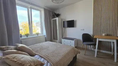 Łóżko lub łóżka w pokoju w obiekcie Apartament Dzielna