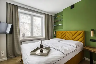 Łóżko lub łóżka w pokoju w obiekcie Piękny Apartament Fredola