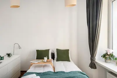 Łóżko lub łóżka w pokoju w obiekcie ShortStayPoland Długosza (B15)