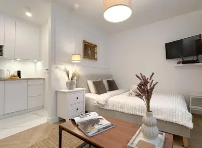 Telewizja i/lub zestaw kina domowego w obiekcie Apartament zielony Mokotów