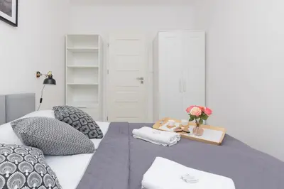 Łóżko lub łóżka w pokoju w obiekcie Warsaw Portofino Apartment by Noclegi Renters