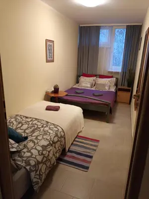Łóżko lub łóżka w pokoju w obiekcie Apartament Pereca 2