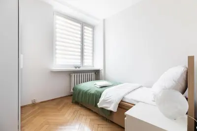 Łóżko lub łóżka w pokoju w obiekcie P&O Apartments Gamerskiego