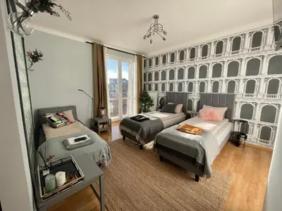 Łóżko lub łóżka w pokoju w obiekcie Słoneczny Apartament Koszykowy!