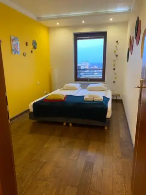Łóżko lub łóżka w pokoju w obiekcie Sunny Life Apartment