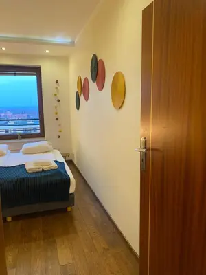 Łóżko lub łóżka w pokoju w obiekcie Sunny Life Apartment