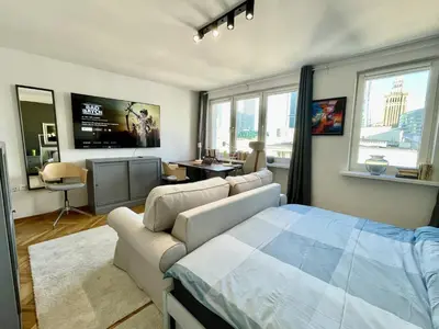 Telewizja i/lub zestaw kina domowego w obiekcie HOLIDAY 4 metro WiFi 70'TV Netflix Disney AppleTV