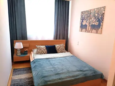 Łóżko lub łóżka w pokoju w obiekcie Rental Apartment Trębacka