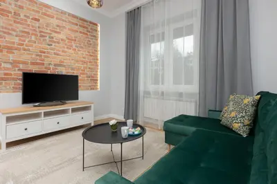 Telewizja i/lub zestaw kina domowego w obiekcie Warszawa Ochota Modern Apartment for Families by Noclegi Renters